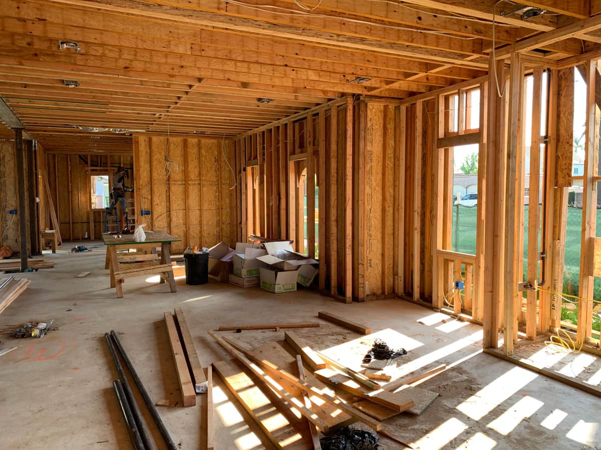 A sunlit interior with exposed wood framing
