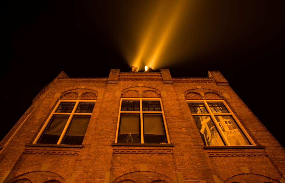A historic brick building lit at night