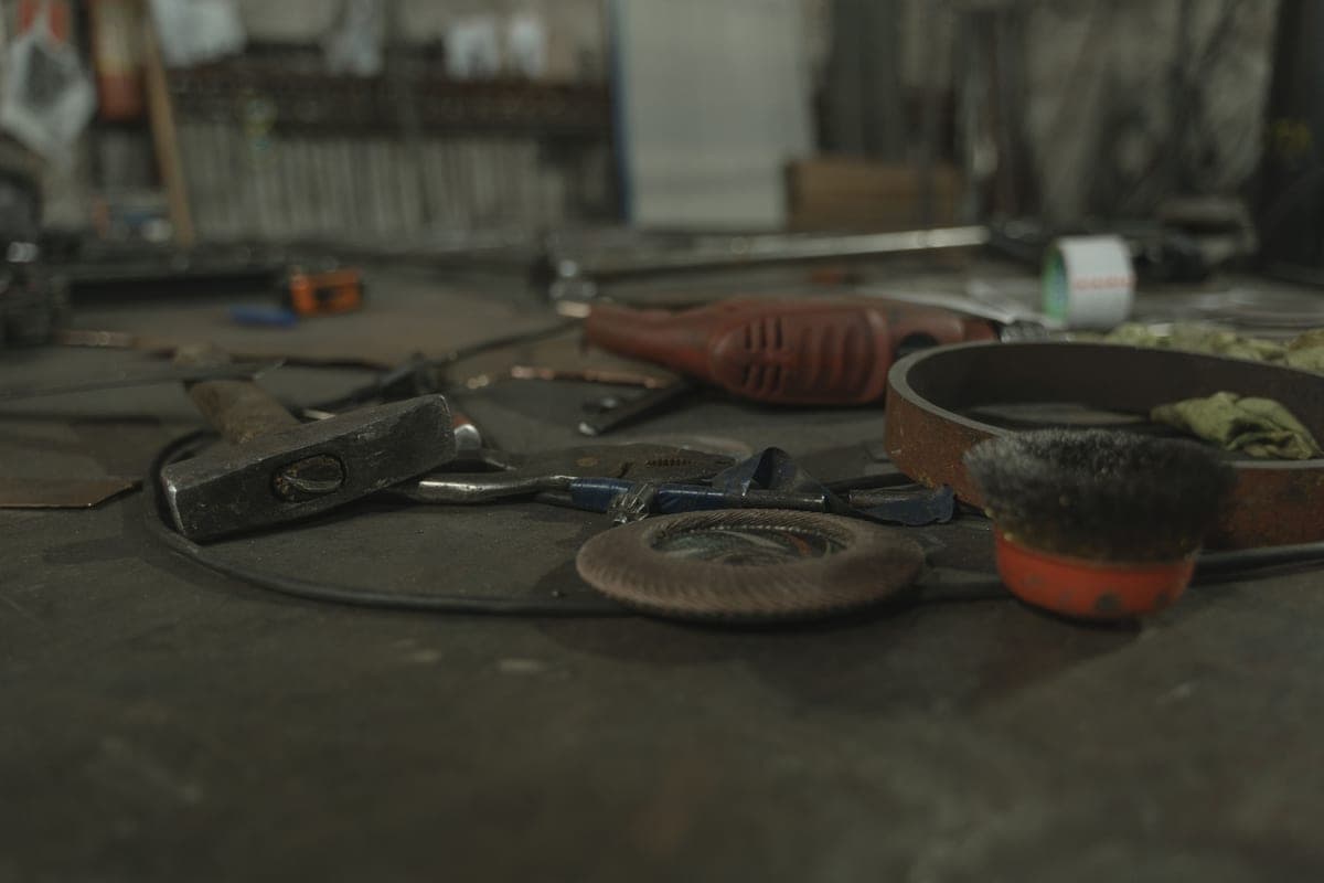 Various hand tools scattered on a workbench