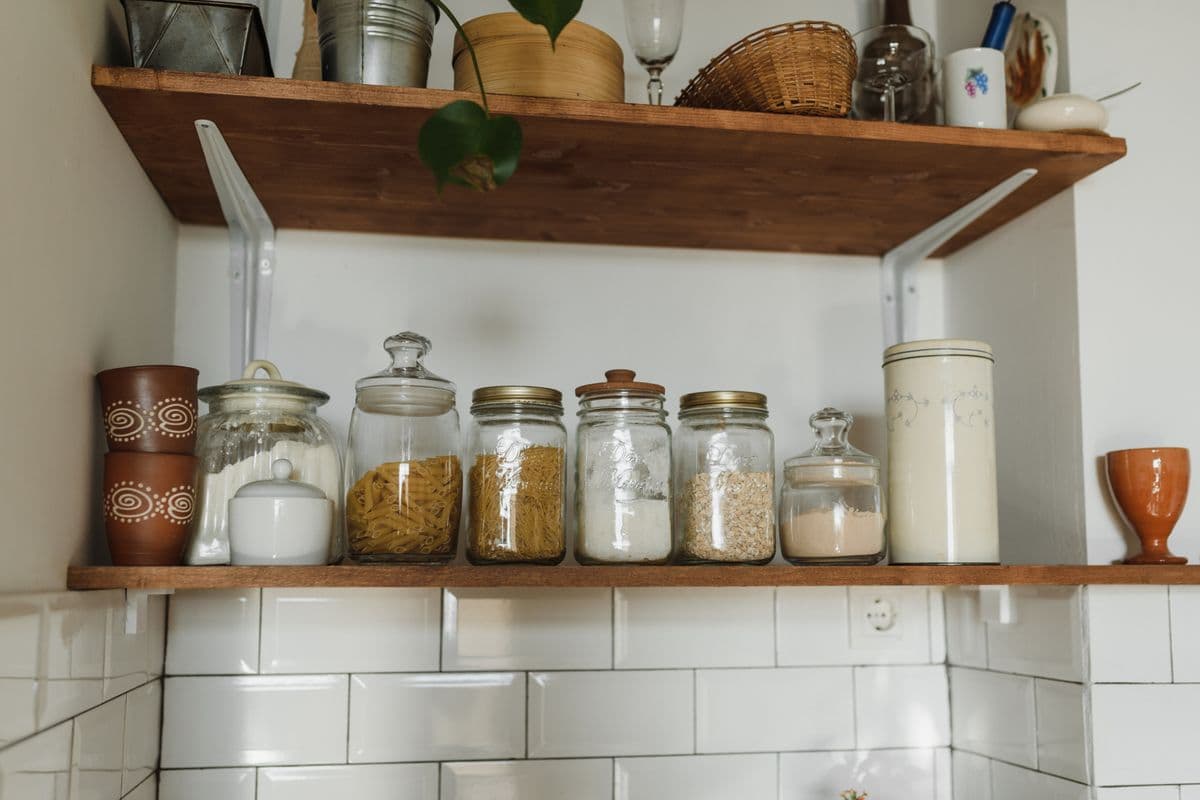 Pantry shelves holding jars and containers of dry food