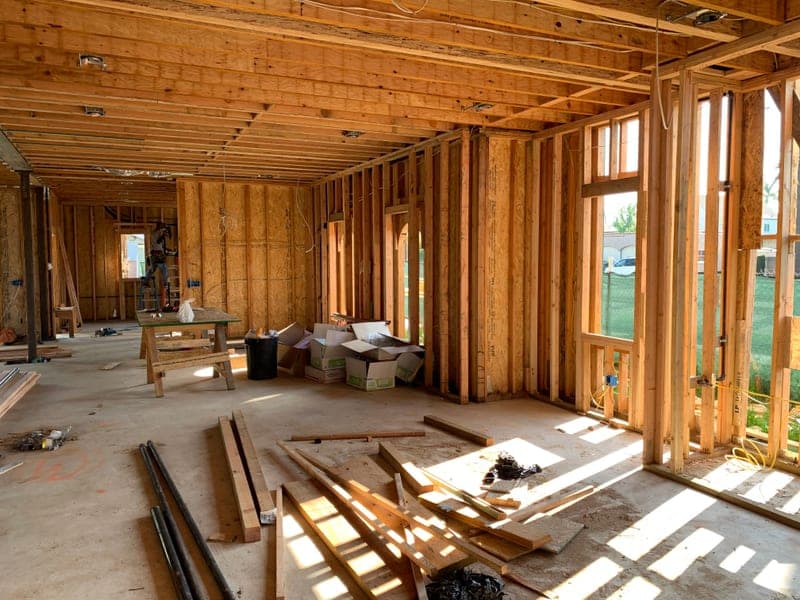 A sunlit loft space with exposed wood framing