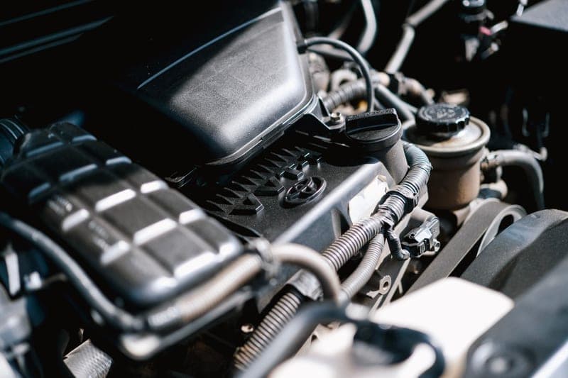 A detailed view of car engine components and cables